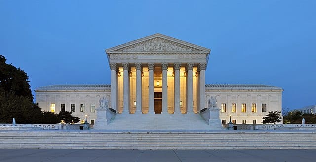 Panorama of the United States Supreme Court Building at dusk.